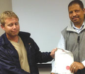 Chris Loubser (l) receiving his membership certificate from Raymond Cloete.